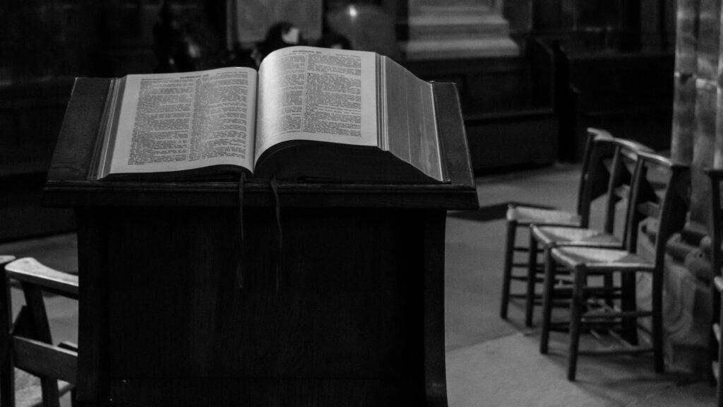 a holy book on wooden church pulpit